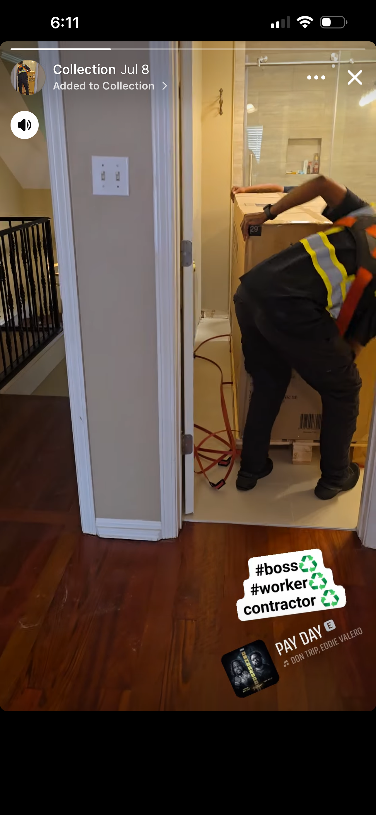 TTC crew member in safety vest installing a refrigerator in a kitchen